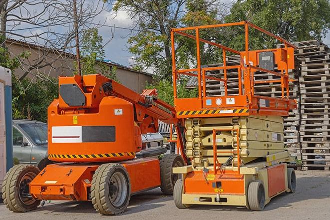 forklift carrying pallets in warehouse in Aptos CA